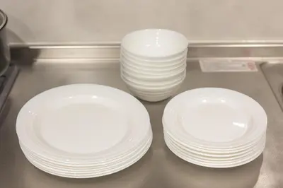 two stacks of white plates sitting on a counter at A Marvelous Blend of Tradition and Modernity, Independent 1st-floor Suite, Accommodates Up to 10 Guests! in Tokyo