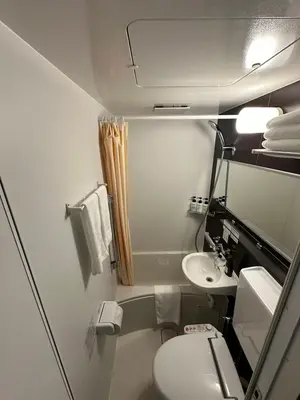 a small bathroom with a toilet and a sink at ELE Hotel \u6771\u65e5\u672c\u6a4b in Tokyo