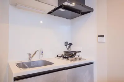 a kitchen with a sink and a stove at The most comfortable and best choice for accommodation in Yoyogi SioY5 in Tokyo