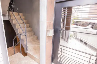 a stairway leading to a room with a window at The most comfortable and best choice for accommodation in Yoyogi SioY5 in Tokyo
