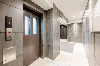 a hallway of a building with metal walls and a hallway at \u30a2\u30f3\u30c9\u30b9\u30c6\u30a4\u58a8\u75303\u4e01\u76ee in Tokyo