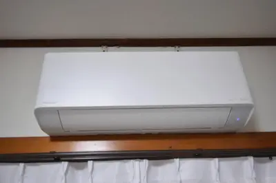 a television sitting on top of a wooden shelf at \u30a2\u30f3\u30c9\u30b9\u30c6\u30a4\u6587\u82b11\u4e01\u76ee in Tokyo