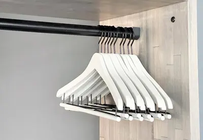 a bunch of knives hanging from a wall at NEXUS HOTEL Gotanda in Tokyo