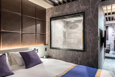 a bedroom with a large bed and a window at NEXUS HOTEL Gotanda in Tokyo