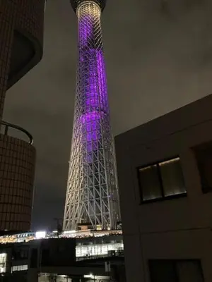 a tall tower is lit up in purple at Sky Tree INN Ⅱ（晴樹宿Ⅱ） in Tokyo