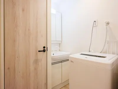 a bathroom with a toilet and a sink at Oyama pantheon in Tokyo