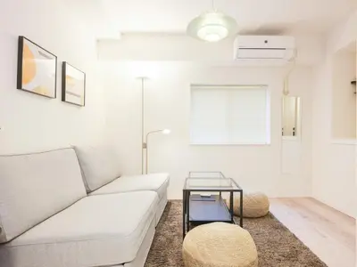 a living room with a white couch and a table at Oyama pantheon in Tokyo