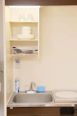 a kitchen with a sink and a counter top at Mi-LOFT SHIBUYA in Tokyo