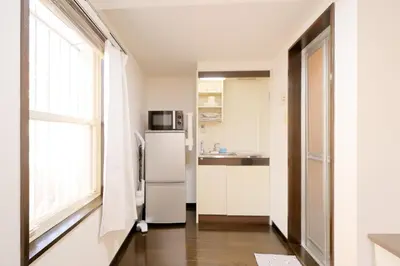 a kitchen with a refrigerator and a window at Mi-LOFT SHIBUYA in Tokyo