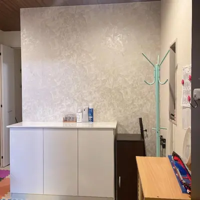 a room with a white cabinet and a wall with a wind turbine at MiShe\u4e3b\u9898\u5357\u884c\u5fb3\u6c11\u5bbf in Tokyo