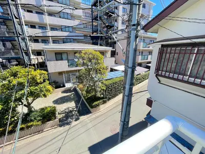 an apartment balcony with a view of a building at Gest Residence EDORIVER Airport Line Self check in in Tokyo