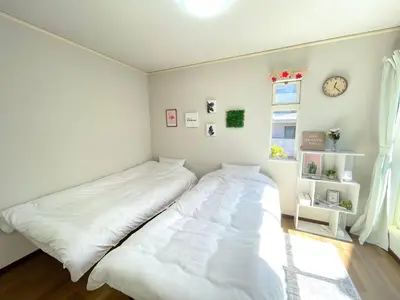 a bedroom with a white bed and a window at Gest Residence EDORIVER Airport Line Self check in in Tokyo