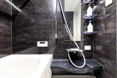 a bathroom with a shower with a toilet and a sink at HAN Tokyo in Tokyo