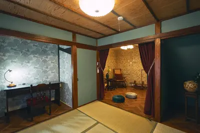 a living room with a room with a table and chairs at Retro Style Japanese House 10-min walk to Asakusa in Tokyo