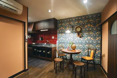 a kitchen with a table and chairs in a room at Retro Style Japanese House 10-min walk to Asakusa in Tokyo