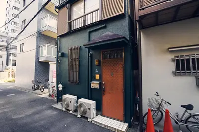 a door to a building with bikes parked outside at Retro Style Japanese House 10-min walk to Asakusa in Tokyo