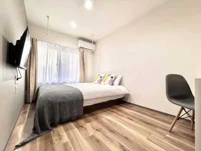 a small bedroom with a bed and a window at ANX Hostel-AD0080 in Tokyo