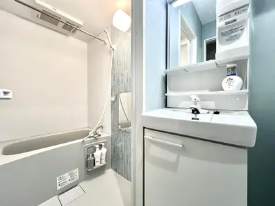 a small bathroom with a sink and a shower at ANX Hostel-AD0080 in Tokyo
