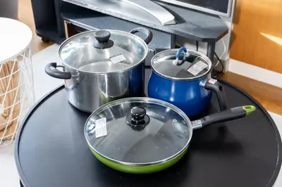 a table with pots and pans on top of it at CoCoHouse Asakusa - SkyTree View, 72\u33a1 in Tokyo