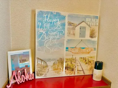 a picture on a wall with a picture of a beach at Tokyo House2 Best location in JUJO 2minutes walk to JR Jujo station in Tokyo