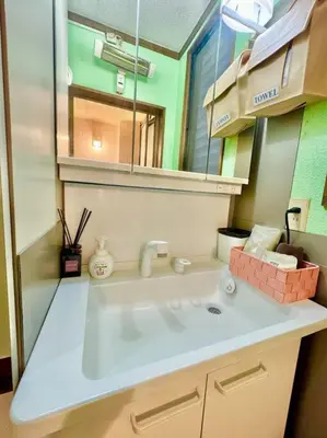 a bathroom with a sink and a mirror at Tokyo House2 Best location in JUJO 2minutes walk to JR Jujo station in Tokyo