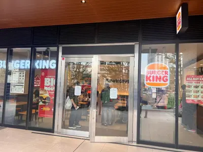 an entrance to a store withiger king signs on the doors at Tokyo House2 Best location in JUJO 2minutes walk to JR Jujo station in Tokyo