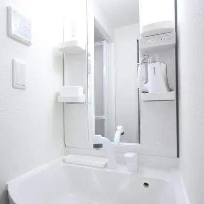 a white bathroom with a sink and a mirror at [Newly built condominium for rent! ] 5 minutes wal - Vacation STAY 98142v in Tokyo