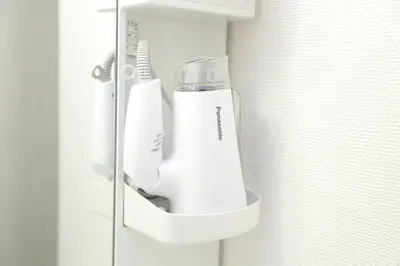 a white hair dryer in a holder on a wall at [Newly built condominium for rent! ] 5 minutes wal - Vacation STAY 98142v in Tokyo