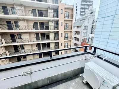 a balcony with a bench in front of a building at \u30db\u30c6\u30eb\u30b5\u30f3\u30af\u30ea\u30b9\u30bf\u30fc #404 in Tokyo