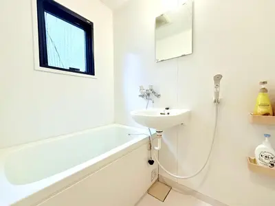 a white bathroom with a sink and a bath tub at \u30db\u30c6\u30eb\u30b5\u30f3\u30af\u30ea\u30b9\u30bf\u30fc #404 in Tokyo