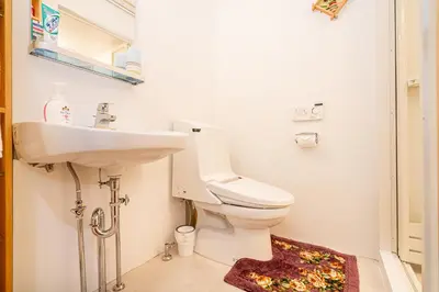 a bathroom with a sink and a toilet at \u4e21\u56fd\u99c5\u524d in Tokyo