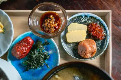 a tray of food with different types of food at Hotel Suzumeya Tsukiji \u30db\u30c6\u30eb\u3059\u305a\u3081\u3084\u7bc9\u5730 in Tokyo