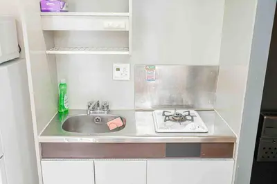 a small kitchen with a sink and a stove at Shinjuku Takadanobaba 6 mins walk 2BR Room301 in Tokyo