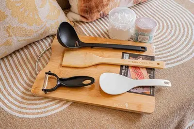 a wooden cutting board with a pair of scissors on it at Shinjuku Takadanobaba 6 mins walk 2BR Room301 in Tokyo
