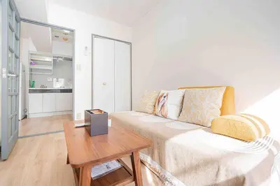 a living room with a couch and a table at Shinjuku Takadanobaba 6 mins walk 2BR Room301 in Tokyo