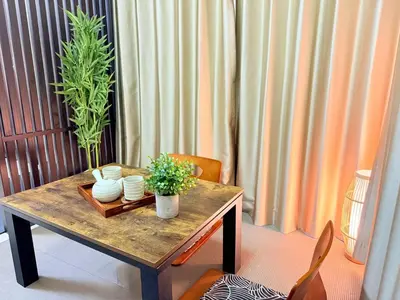 a wooden table with two plants on top of it at Arche de Reve in Tokyo