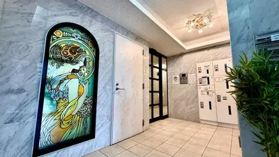 a doorway with a stained glass window in a hallway at Arche de Reve in Tokyo