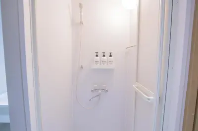 a shower with three bottles on a wall at 1min walk to Higashi Shinjuku sta 8PPL Shinjuku Gyoen\u4e36 National Garden\u4e36 Kabukicho\u4e36 Shinjuku Station\u4e36 Golden Gai\u4e36 Tokyo Metropolitan Government Building YYoQA in Tokyo