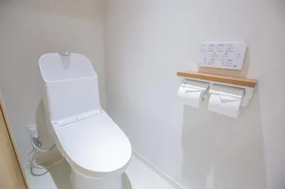 a bathroom with a toilet and two rolls of toilet paper at 1min walk to Higashi Shinjuku sta 8PPL Shinjuku Gyoen\u4e36 National Garden\u4e36 Kabukicho\u4e36 Shinjuku Station\u4e36 Golden Gai\u4e36 Tokyo Metropolitan Government Building YYoQA in Tokyo