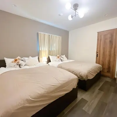 two beds sitting next to each other in a bedroom at 2, Nerima, 1st floor apartment, \u7df4\u99ac in Tokyo
