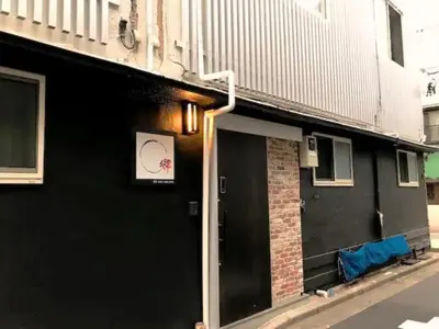 a building with a black door with a sign on it at 2, Nerima, 1st floor apartment, \u7df4\u99ac in Tokyo