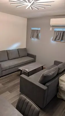 a living room with a couch and a table at 2, Nerima, 1st floor apartment, \u7df4\u99ac in Tokyo