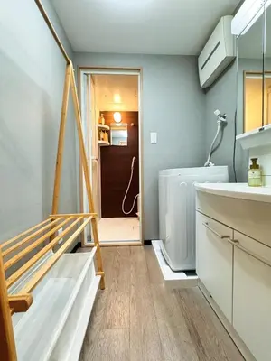 a bathroom with a sink and a staircase in a house at Home Stroy in Tokyo-VENTI Okachimachi \u6771\u4eac\u5c4b\u8a9e in Tokyo