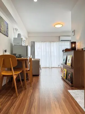 a living room with a table and a dining room at Home Stroy in Tokyo-VENTI Okachimachi \u6771\u4eac\u5c4b\u8a9e in Tokyo