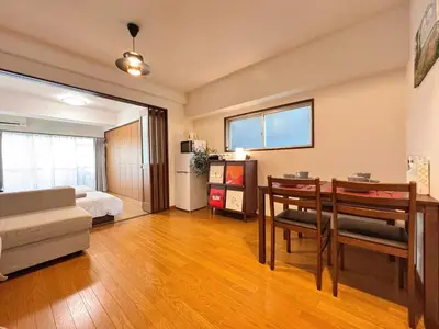 a living room with a bed and a dining room at Home Stroy in Tokyo-VENTI Okachimachi \u6771\u4eac\u5c4b\u8a9e in Tokyo