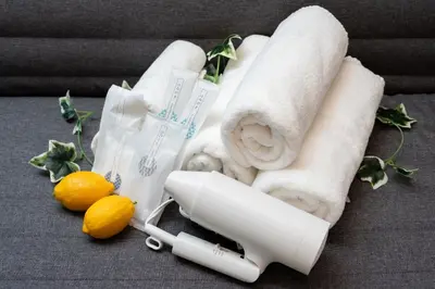 a bunch of towels and lemons on a table at MINI HOUSE Tokyo South in Tokyo