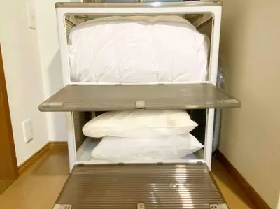 an empty shelf in a room with pillows at SunStay Tachiaigawa 2 in Tokyo