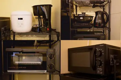 a kitchen with a microwave oven and a coffee maker at AirHOME TOKYO EBISU 102 in Tokyo