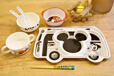 a toy car is sitting on a table with utensils at AirHOME TOKYO EBISU 102 in Tokyo