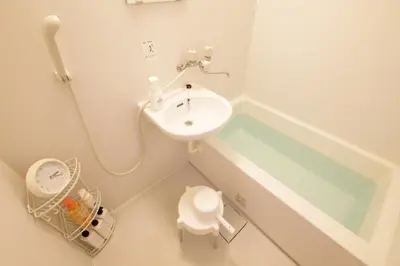 a small bathroom with a sink and a bath tub at AirHOME TOKYO EBISU 102 in Tokyo